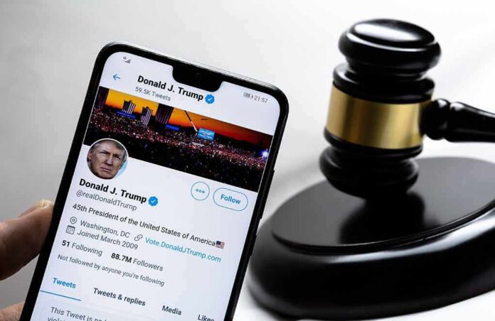 1889360596 featured image Smartphone displaying Twitter profile beside a judges gavel