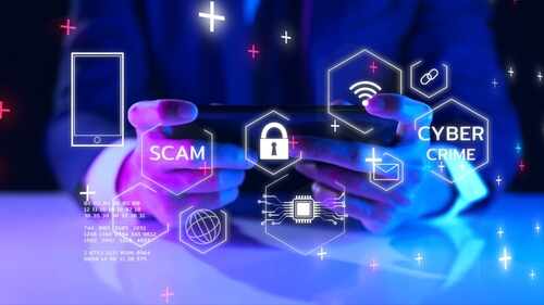 internet scam_2122606175 featured image Person using smartphone with digital security icons displayed