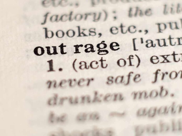 1429846001 featured image Close-up of the word "outrage" in a dictionary.