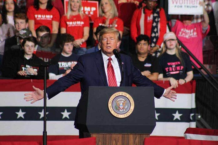 1662925921 featured image Person speaking at podium with crowd behind them.