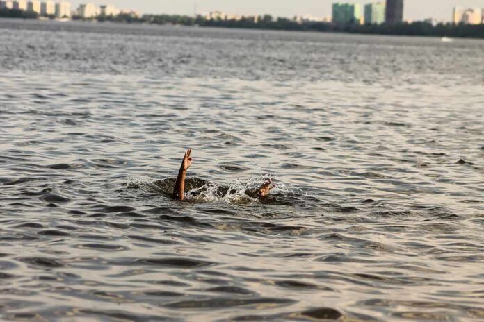 1828334342 featured image Person's hand reaching out from the water
