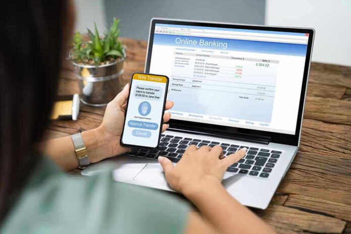 Person using online banking on laptop and smartphone