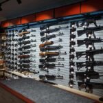 Wall display of various rifles in a gun store
