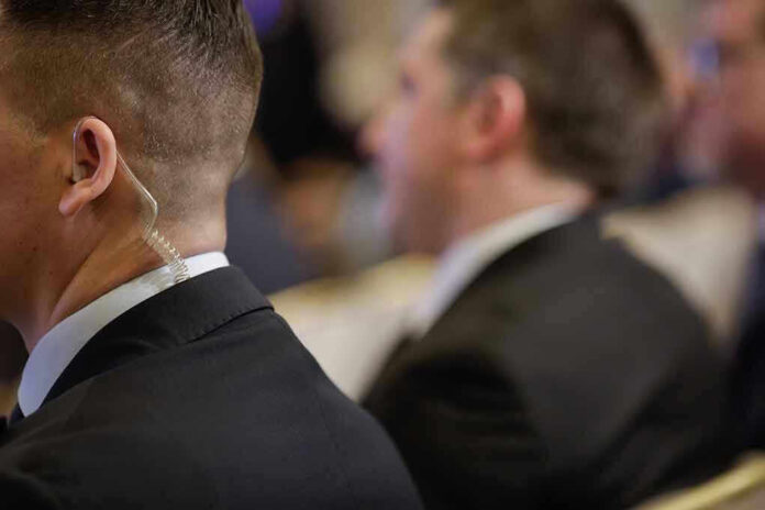 Security personnel with earpiece in a suit