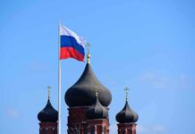 Russian flag next to church domes