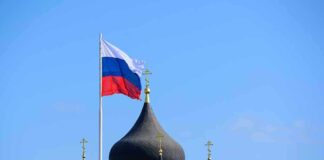 Russian flag next to church domes