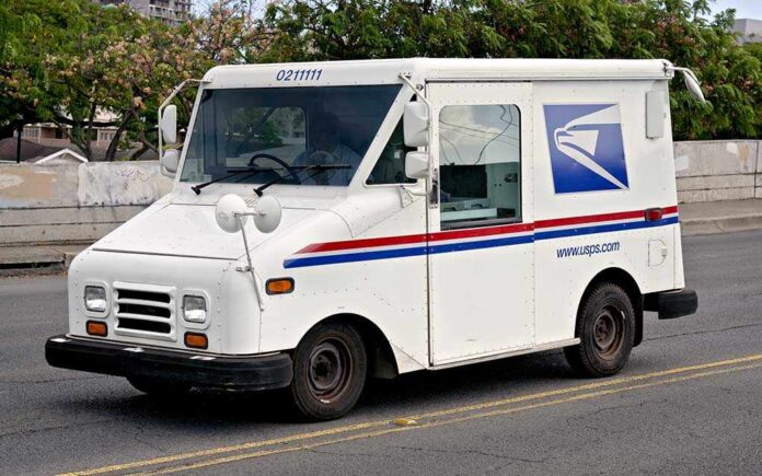 White USPS delivery truck parked on a street