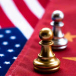China’s Military Buildup: US Homeland at Risk? Chess pawns on USA and China flags