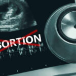 State Blitzes FDA—Abortion Pill War Escalates Ultrasound stethoscope and ABORTION crossed out in red