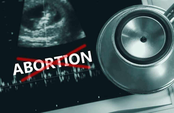 2171348999 Ultrasound stethoscope and ABORTION crossed out in red