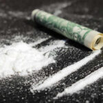 Trump Declares War On Drug Cartels Powder lines, rolled dollar bill on black surface
