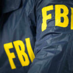 DISGUSTING: FBI Spies on Senators FBI jacket with yellow letters