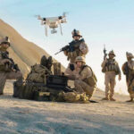 Massive Drone Strike Rattles Russian Military Soldiers operating a drone in a desert environment