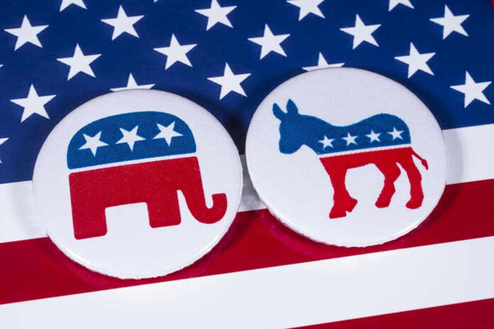 Republican elephant and Democrat donkey on American flag