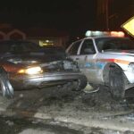 Police Smash Car—Driver Pulled Out Seconds Before Blast A damaged car and a police vehicle involved in a nighttime accident