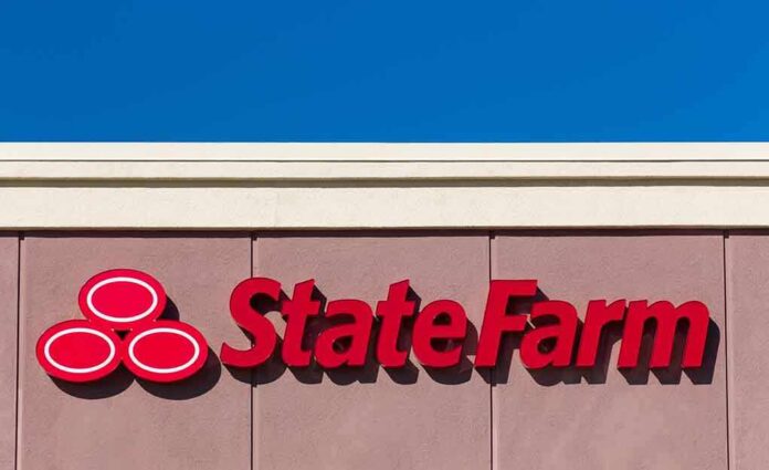 State Farm logo displayed on a building against a blue sky