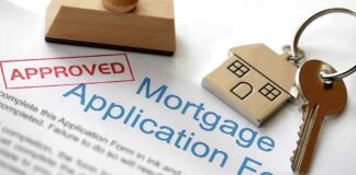Approved mortgage application form with a house key and keychain