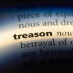 The word treason highlighted in a dictionary.