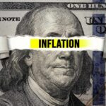 Inflation Plunges–Democrats Shattered! A torn paper strip with the word 'INFLATION' over a hundred dollar bill featuring Benjamin Franklin