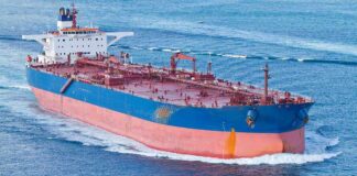 Large cargo ship navigating through the ocean