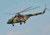 $210 MILLION Rescue — Special HERO “KILLER EGG” Camouflage military helicopter in flight against blue sky.