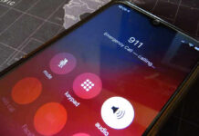 Phone screen showing 911 emergency call in progress.