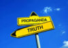 Yellow signs: Propaganda left, Truth right. Blue sky background.