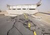 Severely damaged road and collapsed bridge due to earthquake