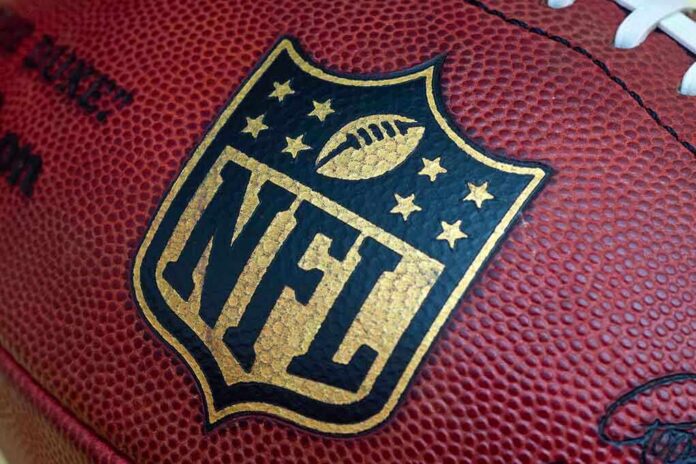 shutterstock_212182807.jpg Close-up of an NFL football with the logo prominently displayed