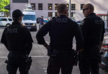 Minneapolis Police Chief Who Blocked ICE Just Resigned in Disgrace Three police officers standing on a city street.