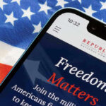 130 Lawsuits Unleashed: RNC’s Election Integrity Blitz Smartphone and American flag promoting Republican National Committee.