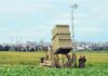 Zelenskyy’s BILLION DOLLAR DEMAND – America on Edge Military defense system deployed in a field with soldiers nearby