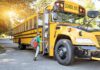Horror Train-School Bus Collision! A child with a backpack boarding a yellow school bus