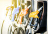 Peace Memo, Price Shock Ahead Colorful gas pump nozzles at a station.