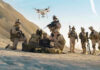 Trump Declared the Cartel Boss Dead — Pentagon Had Nothing to Add Soldiers operating a drone in a desert environment.