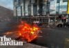 Bus and cars burned in anti-immigration protests in Belfast after stabbing