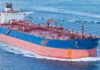 Large cargo ship navigating through the ocean