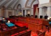 Court Upends Federal Sports Push Interior of a historic courtroom featuring wooden furniture and elegant decor