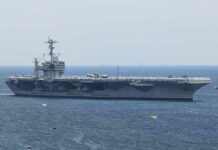 Has the War Really Been Won? Aircraft carrier sailing at sea