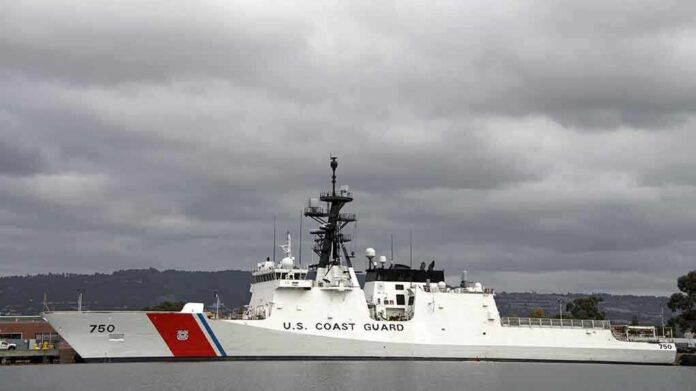 shutterstock_229880047 A U.S. Coast Guard ship docked under cloudy skies
