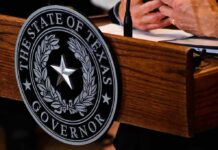 Texas governor seal on wooden podium
