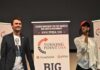 Two speakers on stage at a Turning Point USA event