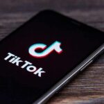 smartphone displaying the TikTok app logo on screen