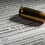 Bullet cartridge on firearm purchase form