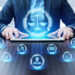 Businessperson using tablet with digital justice icons