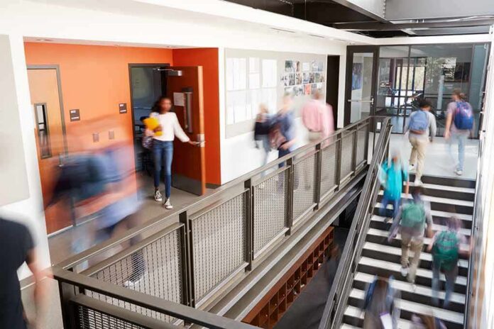 Students walking through a modern school hallway and stairwell