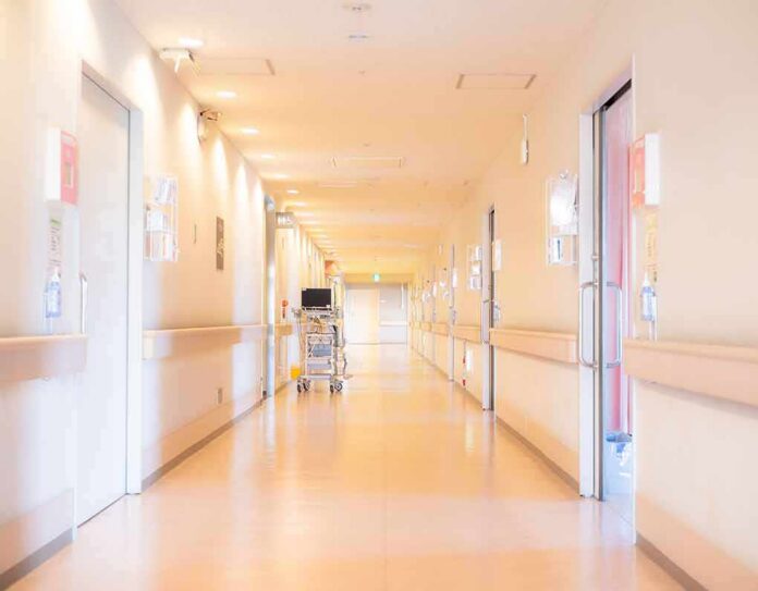 Hospital corridor with doors and medical cart