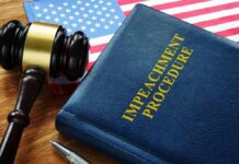 Impeachment procedure book with gavel and U.S. flag