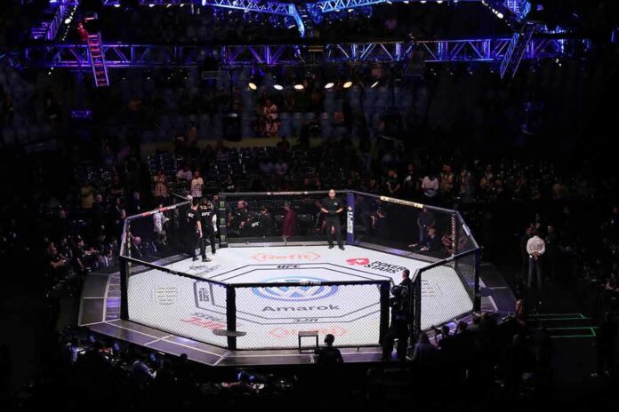 shutterstock_1856056429 MMA octagon in arena under blue lights