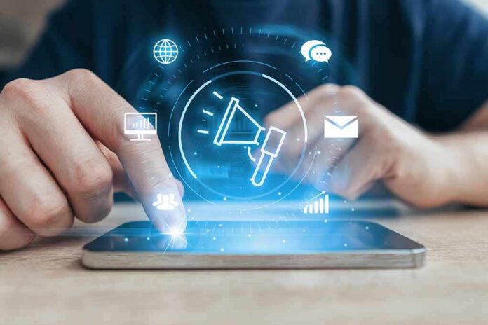 Hands using a smartphone with digital marketing icons overlay
